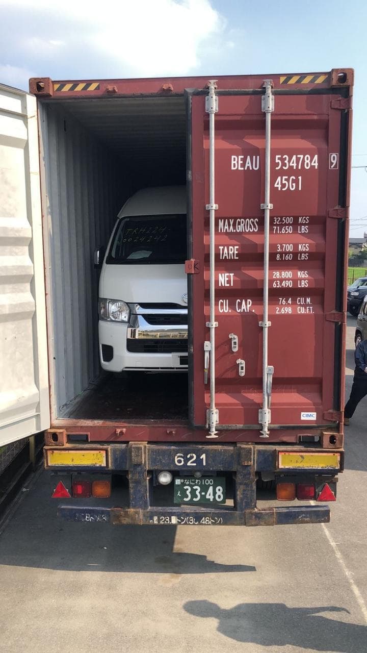 Premium vehicle secured in shipping container